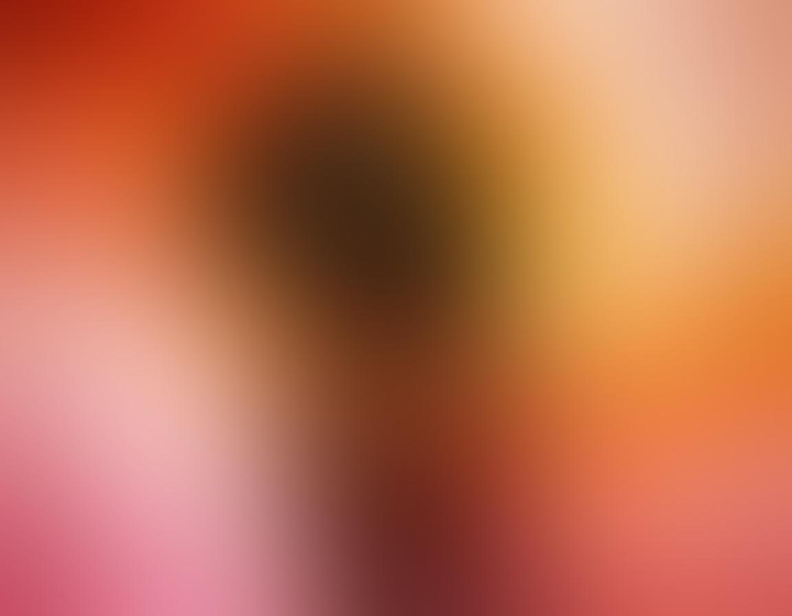 An enchanting, abstract portrayal of a colorful spectrum that flows seamlessly into silhouettes of diverse people engaging in intimate and joyful scenarios. The use of warm and inviting colors should evoke feelings of passion and allure, with gentle curves suggesting fluidity and exploration. Include hints of famous erotic entertainment elements artistically integrated into the background. soft focus, vibrant colors, abstract art.